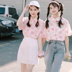 These Peach Print Blouses are the perfect addition to your cute and kawaii wardrobe. Available in white or pink, these blouses feature a playful print of delicate peaches, adding a touch of whimsy to your outfit. The lightweight and airy fabric makes them perfect for any season, keeping you cool in the summer and easily layering for the cooler months. These blouses feature a relaxed fit and short sleeves, making them ideal for casual outings or dressier occasions. Pair them with high-waisted jea Playful Short Sleeve Blouse, Sweet Pink Summer Top, Sweet Pink Summer Tops, Kawaii Style Blouse For Spring, Summer Kawaii Blouse, Spring Kawaii Blouse, Cute Pink Blouse For Spring, Cute Pink Spring Blouse, Cute Strawberry Print Tops For Spring