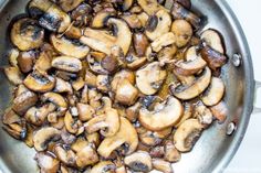 mushrooms are cooking in a pan on the stove