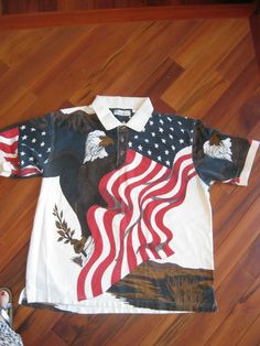 Great shirt, XL American Summer polo shirt. Eagle and the American flag. American Flag Clothes, Stars Graphic, Eagle Flag, American Summer, American Flag Shirt, Flag Shirt, Summer Clothing, Black American, Clothing Co