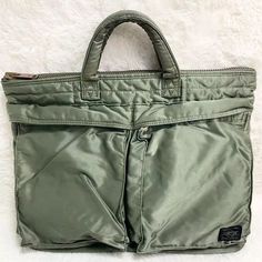 Porter Yoshida Tanker Briefcase SHORT HELMET BAG color Sage Green logo Mens You bought one at United States America today. We only have a few left in stock! ☆We are currently holding a weekend sale!★ Buyers and store followers are getting special deals. See the link in the profile. -------------------- #Porter #tanker #briefcase #shorthelmetbag #sagegreen #mensbag #stuffed #ebay #instocknow #rare Green Zipper Closure Bag For Streetwear, Urban Green Bag With Pockets, Green Rectangular Streetwear Bag, Green Functional Streetwear Bags, Functional Green Streetwear Bags, Functional Green Bags For Streetwear, Casual Briefcase With Zipper Pocket, Color Sage Green, Helmet Bag