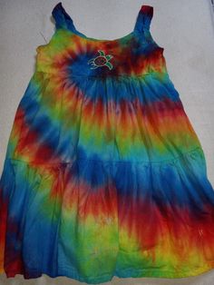 100 percent cotton, hand tie dye with original art embroidery. 2T - size 12!  Pre washed, and pre shrunk!  Color stable!  These are super soft, super popular and super cute!  These are the little dresses little girls love to wear. Super easy to wash, soft and comfy! Lot's of colors available!  Custom orders and colors also available. Colorful Casual Cotton Dress, Casual Colorful Cotton Dress, Tie Dye Cotton Sleeveless Dresses, Tie Dye Sleeveless Cotton Dress, Hand Dyed Cotton Beach Dress, Sleeveless Cotton Tie-dye Dresses, Hippie Multicolor Cotton Dress, Casual Hand Dyed Cotton Dress, Sleeveless Tie Dye Cotton Dresses