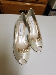 "THIS LISTING IS FOR: US Size 8W Ivory, as shown in pics is ready to ship; HEEL: 1 3/4\" INSIDE LENGHT: 9 3/4\" MEASURE YOUR FEET LENGHT TO ENSURE FIT, FINAL SALE! Wedding Peep toes satin shoes! Hand embellished with a beautiful set of Crystals brooches Please look at the pictures for details! Heel hight in the picture is: 1 3/4'' inches, OTHER SIZES AVAILABLE: COLORS OF SHOES: WHITE, IVORY, OFF-WHITE, CHAMPAGNE COLORS OF JEWELRY: GOLD, OR SILVER To order color samples: www.etsy.com/listing/1297 Elegant Open Toe Champagne Wedding Shoes, Elegant Champagne Open Toe Wedding Shoes, Elegant Gold Low Heel Wedding Shoes, Elegant Gold Fitted Kitten Heels, Classic Open Toe Wedding Heels, Open Toe Kitten Heels For Wedding, Classic Gold Heels For Wedding, Gold Low Heel Wedding Shoes, Elegant Gold Kitten Heels