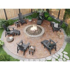 an outdoor fire pit surrounded by chairs and tables