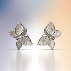 Experience Italian craftsmanship at its finest with our exquisite Diamond dangle drop earrings. The centerpiece of these earrings is a delicate butterfly with elegantly crafted leaves as its wings, creating a captivating and nature-inspired design. Available in both 14k and 18k gold, these earrings bring a touch of luxury and nature's beauty to your style. Elevate your look with the perfect blend of Italian artistry and organic elegance, shop now to adorn yourself with this unique masterpiece. 1 Diamonds Earrings, Delicate Butterfly, Italian Craftsmanship, Italian Jewelry, Nature Inspired Design, Butterfly Shape, Gold Butterfly, Sashiko, Gold Yellow