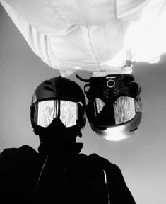 a black and white photo of a person wearing ski goggles