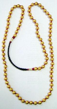 vintage tribal 22 k gold and wax filled round beads necklace from Madurai south India. As worn by all Chettiar(caste) people, Highly sort after piece for any serious collectors will look fabulous with a modern crisp white shirt. Total length-40 inches, we can adjust the length, size of beads- 9 mm, total weight-53 grams, Material -22-carat gold and wax filled. Traditional Adjustable Single Strand Beaded Necklaces, Traditional Adjustable Single Strand Beaded Necklace, Traditional Hand-strung Round Beaded Necklaces, Traditional Single Strand Beaded Necklace, 22k Gold Round Temple Necklace For Puja, Traditional Gold Beaded Necklaces With Round Beads, Traditional Beaded Necklace With Polished Round Pendant, Traditional Beaded Necklace With Round Pendant, Ceremonial Temple Jewelry Necklaces With Round Beads