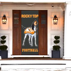 a door with a sign that says rocky top football and a dog on the front