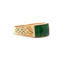 This one of a kind Mid-Century jade ring features a diamond and dot geometric engraved pattern in 14 karat yellow gold. The natural green jade reflects forest green hues. Set in channel bars. A vintage statement ring to admire. The cabochon cut gem is accented by engraved shoulders on a tapered 14K yellow gold band. The ring measures 6mm wide. A stunning gift for you or your loved one. The iconic birthstone of March. Vintage Yellow Gold Signet Ring With Gemstone, Heirloom Emerald Ring Stamped 14k, Heirloom 14k Stamped Emerald Ring, Antique Green Diamond Ring For Formal Occasions, Gold Engraved Emerald Ring For Formal Occasions, Antique Emerald Ring In Stamped 14k Yellow Gold, Heirloom Yellow Gold Engraved Emerald Ring, Heirloom Engraved Emerald Ring In Yellow Gold, Antique Yellow Gold Emerald Ring