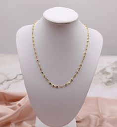 The Diamond-Cut Alternating Bead Necklace features intricately faceted beads that alternate with smooth ones, creating a striking contrast and a sparkling effect. This elegant design adds a touch of brilliance and texture, making it a perfect accessory for both day and night occasions. Length: 17” Closure: Lobster Claw Material: Brass with 18K Gold Plating and Rhodium Coating Lead Free and Hypoallergenic Elegant Faceted Bead Choker Necklace, Elegant Faceted Beads Crystal Choker Necklace, Elegant Crystal Choker Necklace With Faceted Beads, Elegant Gold Choker With Faceted Beads, Faceted Beads Chain Necklace As Gift, Gold Faceted Beads Choker, Gold Choker With Faceted Beads, Gold Faceted Beads Choker Jewelry, Gold Dainty Beaded Necklace With Faceted Beads