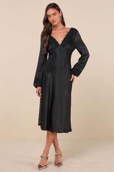 The Lulus Illustrious Elegance Black Satin Long Sleeve Midi Dress is stunning, sweet, and will sweep everyone off their feet! Sleek, stretch-woven satin shapes this stunning dress that features a lightly gathered bodice with a plunging, lace-trimmed V-neck and back, all framed by long balloon sleeves with matching lace trim and elastic at the cuffs. The chic, empire-style waist sits atop the fit-and-flare silhouette that falls to a modern midi hem. Hidden back zipper/clasp. Fit: This garment fit Stretch Bias Cut Dress For Night Out, Fitted Silk Dress With Satin Finish And V-neck, Satin Stretch Midi Dress, Satin V-neck Night Dress, Night V-neck Dress With Satin Finish, Sleek Satin V-neck Midi Dress, Chic Stretch Bias Cut Midi Dress, Chic Stretch Bias-cut Midi Dress, Fitted Satin Knee-length Midi Dress