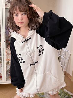 This jacket is crafted from pure cotton fabric, featuring an original design with unique prints and contrasting traditional Chinese frog button closures. Its loose fit is both flattering and stylish. The jacket also comes with convenient pockets on both sides, adding practicality to its charm. To top it off, the hood is adorned with soft and adorable bear ears, making it irresistibly cute when worn.  The price includes one jacket only.   	 		 			Size 			Free Size 		 		 			Bust 			140 		 		 			Le Black Harajuku Style Cotton Outerwear, Black Cotton Harajuku Outerwear, Harajuku Style Cotton Outerwear With Pockets, Harajuku Style Winter Cotton Outerwear, Harajuku Style Cotton Hoodie Outerwear, Harajuku Style Cotton Outerwear With Drawstring Hood, Cotton Hoodie With Buttons For Fall, Casual Cotton Hoodie With Button Closure, Harajuku Cotton Long Sleeve Outerwear