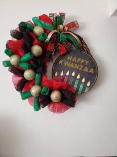 a wreath that says happy kwanza hanging on the wall