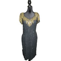 BLACK TIE presents a vintage, stunningly embellished evening dress. Fashioned in black and gold, it features intricate beading and sequins on 100% silk. A show-stopping piece for any formal occasion.  Vintage but meticulously well cared for and stored Features: * Beaded & Sequined Size: Womens 10 Condition: Pre-Owned Like New Intricate Beading, Black Tie Dress, Tie Dress, Dress Clothes For Women, Black Tie, Formal Occasion, Black And Gold, Evening Dress, Evening Dresses