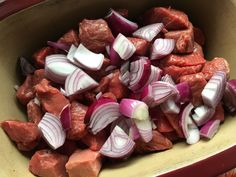 chopped meat and onions in a yellow bowl