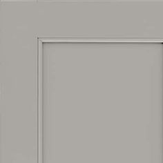 an image of a gray door with white trim and black handle on the bottom panel