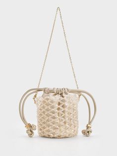 Petite in size, this beaded bucket bag is the perfect companion for various special occasions, from daytime weddings to evening soirees. Despite its small size, the bag can accommodate most of your essentials. The highlight of this piece is undoubtedly the exquisitely beaded finish that offers a touch of shine. It will effortlessly elevate any outfit and also features a delicate, non-adjustable chain strap for easy carrying. Beaded Bucket Bag, Daytime Wedding, Brand Collaboration, Charles Keith, Egift Card, Beaded Chain, Chain Strap, Bucket Bag, Gift Card