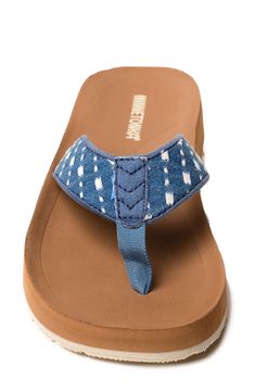 A cushioned footbed and thick rubber sole lend comfortable support to a stylish flip-flop secured with a center toe post. Cushioned footbed Textile upper and lining/rubber sole Imported Casual Flip Flops With Branded Insole And Toe Post, Casual Toe Post Flip Flops With Ortholite Insole, Adjustable Toe Post Flip Flops With Ortholite Insole, Casual Canvas Sandals With Rubber Sole, Adjustable Cushioned Round Toe Flip Flops, Adjustable Cushioned Slip-on Flip Flops, Adjustable Cushioned Toe Post Flip Flops, Denim Slip-on Sandals For The Beach, Denim Blue Round Toe Sandals For Beach