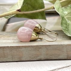 Delicate dangle earrings made with gorgeous teardrop shaped Rose Quartz gemstones.                                  These earrings are so unique, they will lend your look a touch of elegance.  The Rose Quartz teardrop is about 0.9" ( 23 mm ) long and the largest part of the teardrop is about 0.53" ( 13 mm ) wide. These earrings can be made with 14 K gold filled ear wires or lever backs ( as shown in the pictures ) and the earrings full length is about 1.4" ( 35 mm ). Rose Quartz is the stone of Teardrop Crystal Earrings Gift, Teardrop Crystal Earrings For Pierced Ears Gift, Pink Teardrop Earrings With Natural Stones, Teardrop Crystal Earrings With Ear Wire As Gift, Pink Teardrop Crystal Earrings, Rose Quartz Teardrop Earrings For Gift, Adjustable Teardrop Pendant Earrings As Gift, Teardrop Natural Stone Earrings, Natural Stone Dangle Teardrop Earrings For Gift