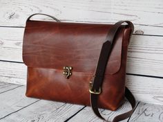 Gorgeous, medium-sized distressed brown crossbody bag.  Made with a high quality brown pull-up leather: the waxy finish gives that sought-after antique effect. Brown leather strap, with buckle for adjusting the length.  Natural suede interior and attractive swing arm clasp.  Simple yet elegant.  ***Dimensions***  Width/Height/Depth: 32(top)x22x7cm  If you have any questions please let me know.  Have a great day Large Purse, Brown Crossbody Bag, Brown Crossbody, Brown Leather Strap, Pull Up, Pull Ups, Crossbody Strap, Have A Great Day, Medium Size