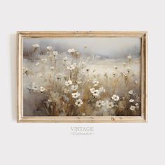 a painting hanging on the wall with white flowers in it's center and an old wooden frame