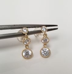 "Thanks for shopping our vintage estate store. We tend to sell well below wholesale and truly hope you enjoy all of our items. Many of the items are one of a kind, so please enjoy scrolling through the pictures and hopefully something will catch your eye. Black spots are from camera or reflections. Nice estate 10k yellow gold .50ct cz diamond dangle earrings. Length: 1/2\" Width: 1/8\" Weight: 0.86 gram Marked 10k and backs are included as well." Gold Bridal Earrings With Brilliant Cut Dangle, Vintage Gold Dangle Diamond Earrings, Vintage Cubic Zirconia Dangle Jewelry, Gold Dangle Bridal Earrings With Prong Setting, Vintage Dangle Cubic Zirconia Earrings, Vintage Cubic Zirconia Dangle Earrings, Vintage Dangle Earrings Cubic Zirconia, 14k Stamped Drop Earrings For Anniversary, 14k Stamped Dangle Earrings For Anniversary