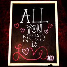 a chalkboard with the words all you need is love written on it