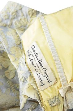 an old yellow jacket with a label on it