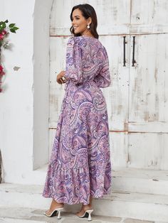 This paisley maxi dress will make you the star of any western wonder! The vibrant print and flowy silhouette will have you feeling free and fearless, while the low V-neckline and quarter sleeves add a touch of elegance. Perfect for a day out in the sun or a night out under the stars. Size Guide: Model is 5’8” tall, and has a 33.4” bust, 26.4” waist, & 35.4” hips. She is wearing a S / US 4 / AU 8. This dress is true to size. Material: 100% Polyester Feature: V-Neckline. Ruffle Bell Sleeves. Swirl Paisley Print. Side Slit. Waist Tie Detail. Wrap dress. Maxi length. Not lined. Relaxed fit. Care Instructions: Machine wash / Cold hand wash Bohemian Paisley Print Patterned Maxi Dress, Spring Paisley Print Maxi Dress, Spring Paisley Print V-neck Maxi Dress, Spring V-neck Maxi Dress With Paisley Print, Purple Printed Maxi Dress, Purple Maxi Dress With Boho Print, Patterned Paisley Print Maxi Dress With V-neck, Patterned Paisley Print V-neck Maxi Dress, Bohemian Flowy Maxi Dress With Paisley Print