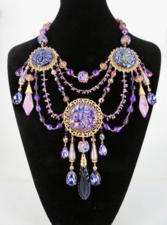 Absolutely Frivolous purple lady & floral Art Nouveau necklace with my original lustre glass features and beads, antique 1920s drops, facetted amethyst hand beaded chains, Swarovski tanzanite drops,  lampwork drops & beads, gold plated filigrees with added patina, lobster clasp with tag, extender chain Purple Jewelry For Mardi Gras, Ornate Purple Dangle Jewelry, Purple Beaded Vintage Necklace, Vintage Purple Beaded Necklace, Ornate Handmade Purple Jewelry, Purple Beaded Jewelry For Mardi Gras, Bohemian Jewelry For Mardi Gras Party, Purple Vintage Beaded Necklace, Bohemian Mardi Gras Party Jewelry