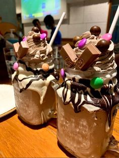 two glasses filled with ice cream and chocolate