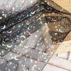 stars and moon printed sheer mesh fabric on top of woven wicker tablecloths