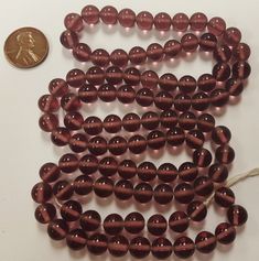 "You will receive 100 Pieces Vintage Japanese 1950's Cherry Brand Glass Amethyst Smooth Round Handmade Beads On Temporary String. \"Made In Japan\" Tag May Not Be Included. Circa Late 1940's To Early 1950's. Each Handmade Bead Is Unique And May Vary In Size & Color Slightly Beads measure 8mm. Round (Hole To Hole Bead Measurement Is 7.5mm.) Approx. .5mm. New Unused Vintage Stock - NOS - New Old Stock. More beautiful Vintage Cherry Brand Beads.... Click below: https://www.etsy.com/shop/MLRober Vintage Cherry, Thanks A Bunch, Handmade Beads, Vintage Copper, Bead Caps, Vintage Japanese, Round Beads, Coupon Codes, Cherry