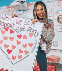 a woman holding up a sign that says what we love about our class