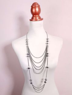 This vintage pre-loved Y2K necklace features a long multi-tiered design made up of stylish, interspersed faceted grey glass beads and draped multi-roped chains. Finished with an extender and lobster claw clasp. Era - Y2K early 2000s Materials - Silver coloured metal and glass beads 52cm to 55cm drop 12mm Bead width Excellent condition Early 2000s Necklaces, 2000s Necklace, Early 2000s Jewelry, Couture Aesthetic, 2000s Jewelry, 20s Style, Y2k Necklace, Tiered Necklace, Y2k Jewelry