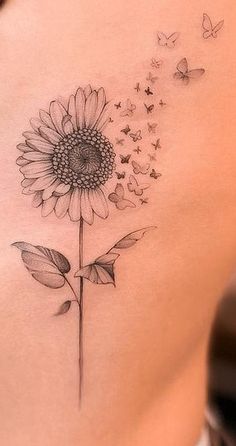 a woman's stomach with a sunflower and butterflies on the side, next to an instagram page