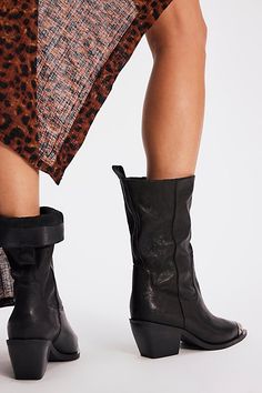 It’s all in the details with these slouchy, Western-inspired boots, featured in a mid-calf length with a soft pebbled leather upper and filigree toe cap for the perfect hint of shine. **Features:** Mid-calf length, slouchy style, pull-on design, pointed toe, filigree metal toe cap, chunky block heel **Why We | Faster Horses Filigree Boots by FP Collection at Free People in Black, Size: US 8.5 Calf Leather High Ankle Mid-calf Boots For Fall, Fall Wide Calf Mid-calf Boots In Calf Leather, Wide Calf Mid-calf Boots In Calf Leather For Fall, Wide Calf Leather Mid-calf Boots For Fall, Leather Mid-calf Heeled Boots For Fall, Chic Leather Mid-calf Heeled Boots, Wide Calf Leather Moto Boots, Leather Wide Calf Mid-calf Moto Boots, Wide Calf Leather Mid-calf Moto Boots