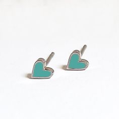 Beautifully dainty heart studs with mint enamel detail.  Made with silver plated stainless steel and a pop of enamel. Perfect gift to spread some love. Presented in a premium gift box. Green Nickel-free Heart Earrings As Gift, Trendy Green Heart Earrings For Gift, Cute Green Heart Earrings For Gift, Cloisonne Enamel Jewelry, Enamel Stud Earrings, Cloisonne Enamel, Mini Heart, Premium Gift, Lovely Earrings