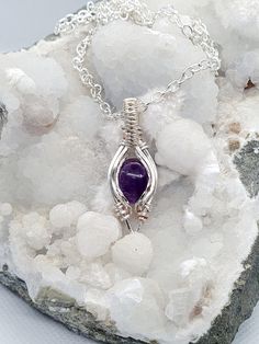 Amethyst wrapped in silverplated copper wire. This elegant and unique piece of jewelry is a perfect gift for an anniversary or birthday, or maybe you want to treat yourself. Adds that little extra to your everyday wear while it also works for special occations. Metaphysical Properties Of Amethyst: Being such a prominent crystal, Amethyst possesses many beneficial metaphysical properties, calmness, balance, and peace. People also use it to eliminate impatience. It is a meditative and calming ston Hand Wrapped Spiritual Jewelry For Anniversary, Spiritual Hand Wrapped Jewelry For Anniversary, Spiritual Wire Wrapped Necklaces For Anniversary, Nickel-free Amethyst Crystal Necklaces As Gift, Nickel-free Amethyst Crystal Necklaces For Gift, Nickel-free Amethyst Crystal Necklace As Gift, Amethyst Wire Wrapped Necklace Gift, Sterling Silver Hand Wrapped Necklace For Gift, Wire Wrapped Purple Jewelry Gift