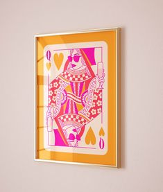 an ace playing card hangs on the wall