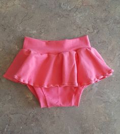 "Jersey knit skirted bummies, diaper cover bloomers Shorts Stretch cotton / spandex fabric for comfort. All skirted bummies will be made like the first picture. Waist size before stretch: Newborn: 12-13\" (up to 8 lbs) 0-3 Months W: 14\" 3-6 Months W: 16\" 6-12 Months W: 16.5\" 12-18 Months W: 17\" 18-24 Months W17.5\" 2T W: 18\"-19\" Feel free to send me your child's exact measurements and I can customize the waist or length to their specific size. *Please note, pattern placement may vary, and Cute Bottoms With Built-in Shorts For Playwear, Bottoms With Elastic Waistband For Playtime, Fitted Cotton Bloomers With Ruffles, Fitted Bottoms For Playwear In Spring, Cute Pink Short Bloomers, Cute Short Pink Bloomers, Pink Elastic Short Bottoms, Cute Fitted Bottoms With Ruffles, Elastic Cotton Ruffled Bottoms