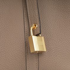 Carefully crafted from supple, Maurice leather, Hermès presents their stunning mini Picotin 18 bag in a beautiful combination of Beige De Weimar Maurice and complimented with gold tone hardware. Hermès is acclaimed for their leather quality, as well as being at the very top of the fashion hierarchy. Simple, elegant, and understated, each Hermès bag is timeless and tasteful. SPL Exterior Beige De Weimar Maurice leather Gold hardware Two top handles Hermès logo stamp Protective feet at base Slouchy silhouette U stamp - 2022 production Brand new condition Interior Raw hide leather interior Hermes embossed logo at base Open compartment Brand new condition Sold with box, dustbag, lock and keys and receipt SPL Height 18cm Width 12.5cm Depth 18cm Prada Crossbody, Prada Crossbody Bag, Chic Me, Timeless Handbag, Simple Elegant, Logo Stamp, Luxe Fashion, Hermes Bag, Bags Designer Fashion