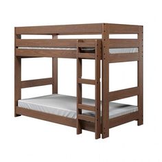 a wooden bunk bed with white mattresses on it's bottom and bottom bunk