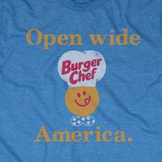 a blue t - shirt with an open wide burger chef on it's chest