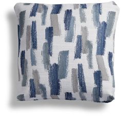 a blue and white pillow with an abstract design on the front, in shades of gray