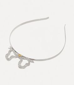 Our Bow Alice band showcases an intricate Georgian-inspired butterfly bow charm, a classic design featured in numerous collections. Crafted in polished silver-tone plating, this statement headband includes our timeless orb motif at the centre of the bow, representing the heritage of the house and Vivienne's innovative approach to tradition. Statement Headband, Bow Charm, Butterfly Bow, Alice Band, Ring Watch, Backpack Travel Bag, Lace Boots, Vivienne Westwood, Lace Up Shoes