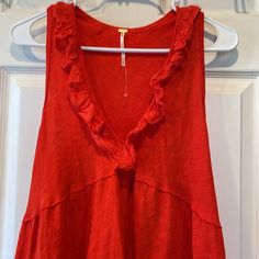 Gorgeous Deep Orange-Almost Red Color! Vibrant! Sleeveless, Empire Waist, Ruffle V-Neck, Ruffle Hem, Raw Edging, Cotton Linen Blend So Lightweight And Flowy New Without Tags! Great For Layering! Size Xs But Can Certainly Fit Small Possibly Medium Has Stretch 52% Linen 48% Cotton Ptp 16” But Stretches To 21” Length 24” Boho Bohemian Beach Summer Spring Lounging Layering Lightweight Casual Red V-neck Vest, Casual Red V-neck Tank Top, Red V-neck Cotton Vest, Red Camisole Tank Top For Summer, Red Sleeveless Tank Top For Summer, Red Sleeveless Tank Top For The Beach, Red Sleeveless Tank Top For Beach, Sleeveless Red Tank Top For Beach, Red V-neck Vest For Spring