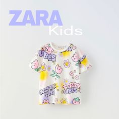 Graffiti T-Shirt Round Neck T-Shirt With Short Sleeves. With Neon Flowers Details New With Playful Printed Short Sleeve T-shirt, Multicolor Cartoon Print T-shirt For Spring, Zara T-shirt With Letter Print For Spring, Casual Purple T-shirt With Cartoon Print, Zara Pink Casual T-shirt, Cute Multicolor Graphic Print T-shirt, Zara Playful Cartoon Print T-shirt, Cute Multicolor Printed T-shirt, Purple Printed Summer T-shirt