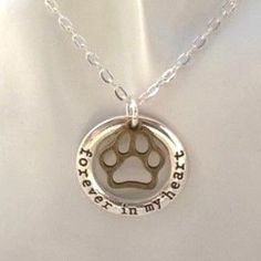 Handmade "Forever In My Heart" Paw Print Charm Necklace Adorned With An Open-Worked Paw Print Charm, This Beautiful Necklace Makes A Great Gift For The Dog Lover In Your Life ~Silver Plated Open Circle Charm Is Engraved With The Words "Forever In My Heart" And Measures Just Over 1" Diameter ~Bronze Plated Paw Print Charm Adds A Touch Of Whimsy, Measures Just Over 1/2" ~Silver Plated Rolo Chain Necklace Measures 18 Inches Long. Meaningful Silver Jewelry With Heart Charm, Hand Stamped Heart Jewelry For Memorial, Hand Stamped Silver Necklace For Keepsakes, Silver Hand-stamped Heart Pendant Jewelry, Meaningful Hypoallergenic Silver Jewelry, Silver Hypoallergenic Meaningful Jewelry, Silver Open Heart Engraved Charm Necklace, Silver Engraved Open Heart Charm Necklace, Silver Stainless Steel Open Heart Jewelry