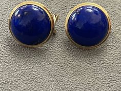 Estate/ Vintage 14KT Yellow Gold Rounded Square Shape, Genuine, Blue Lapis Omega Back Earrings Measures: 20mm x 20mm Weight: 9.2grams Omega Back Closure Stamped 14K Excellent estate condition! Beautiful bright blue color! Wear them by themselves or interchange earring charms in them!  Earring charms shown are an example + sold separately. Check out all our omega back earrings + our entire jewelry collection! Please let us know if you have any questions. International buyers: you are responsible for paying any VAT/Custom fees as directed by your country. We do not have any control over those fees. Thank you, Legacy Saint Jewelry Luxury Blue Round Cabochons, Classic Blue Gemstone Cabochons, Blue Classic Cabochons For Formal Occasion, Classic Blue Cabochons For Formal Occasion, Blue Classic Formal Cabochons, Blue Formal Classic Cabochons, Classic Blue Round Earrings, Blue Round Earrings For Formal Occasions, Formal Blue Round Earrings