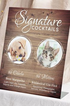 a wooden sign with two cats and a dog on it that says signature cocktails